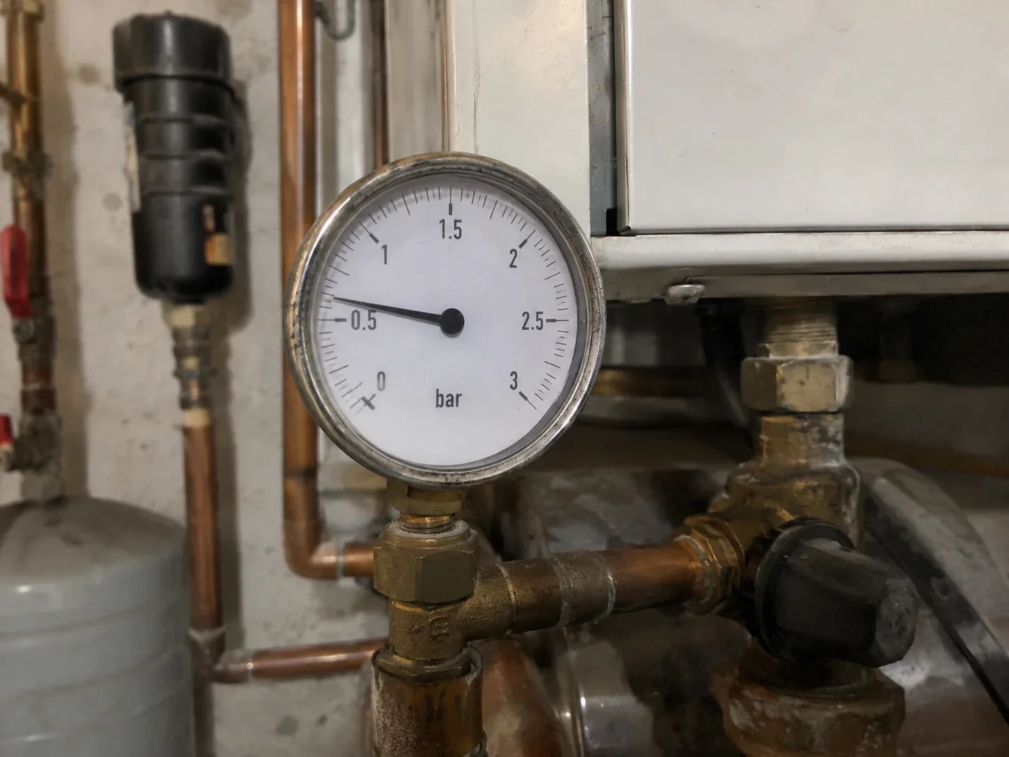 Close-up of a residential boiler pressure gauge