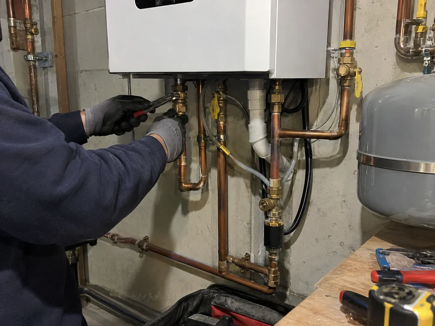 New wall-mounted gas boiler installed in a Toronto home's utility room